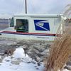 Postal Truck Gets Stuck In Street Of Ice Water Post-Blizzard